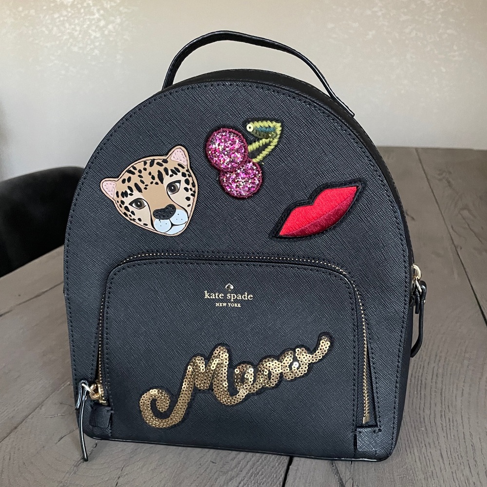 Kate Spade “Leopard Tomi” backpack